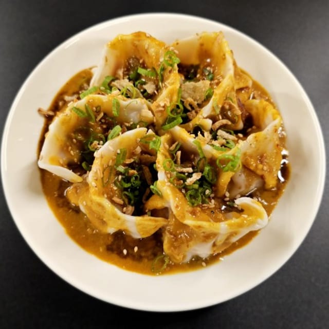 Chicken and Mushroom Dumplings in Satay sauce.